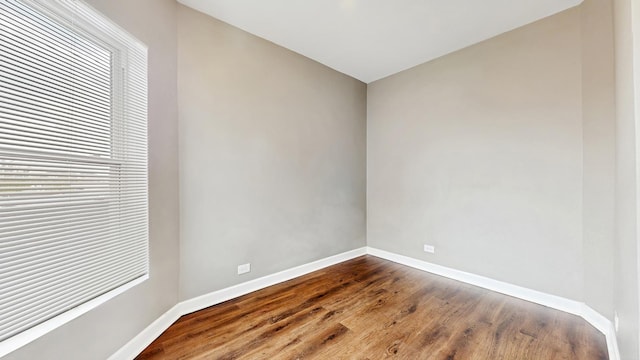 6347 S Drexel Ave, Chicago, IL 60637 - unfurnished room with baseboards and dark wood-style flooring