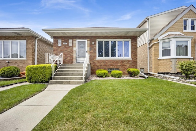 5548 S Kedvale Ave, Chicago, IL 60629 - bungalow-style house featuring a front yard, brick siding, and covered porch