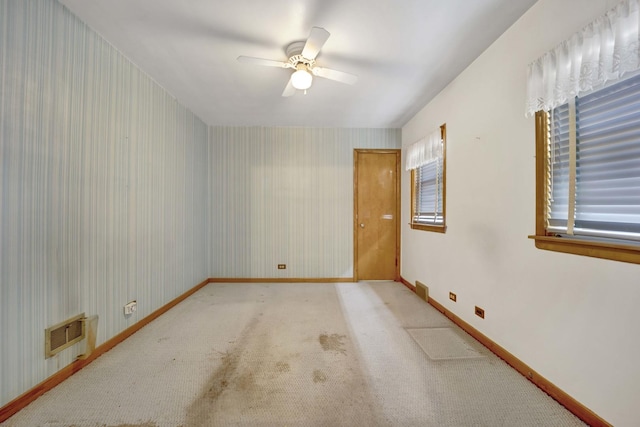 5548 S Kedvale Ave, Chicago, IL 60629 - carpeted empty room with ceiling fan, baseboards, and wallpapered walls
