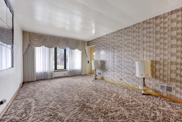 5548 S Kedvale Ave, Chicago, IL 60629 - spare room with carpet, wallpapered walls, and baseboards