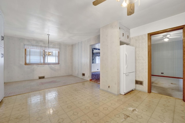 5548 S Kedvale Ave, Chicago, IL 60629 - unfurnished room with a ceiling fan, light flooring, wallpapered walls, and a chandelier
