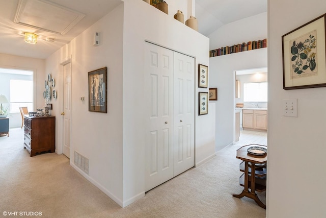 645 Concord Way Unit 645, Prospect Heights, IL 60070 - hallway featuring light carpet, a sink, lofted ceiling, and baseboards