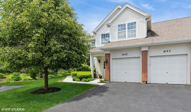 645 Concord Way Unit 645, Prospect Heights, IL 60070 - townhome / multi-family property featuring asphalt driveway, a front lawn, a shingled roof, and a garage