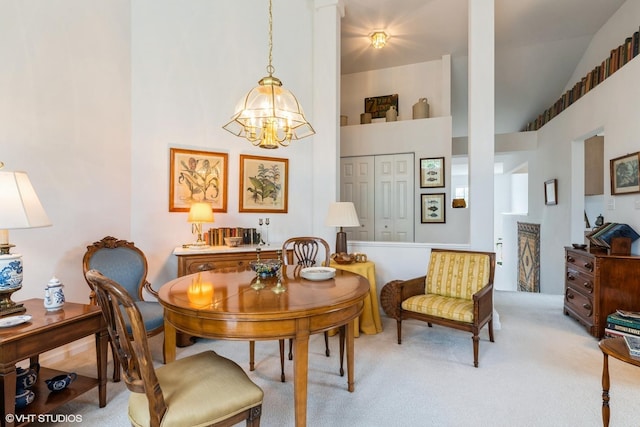 645 Concord Way Unit 645, Prospect Heights, IL 60070 - dining space featuring a chandelier, light colored carpet, and high vaulted ceiling