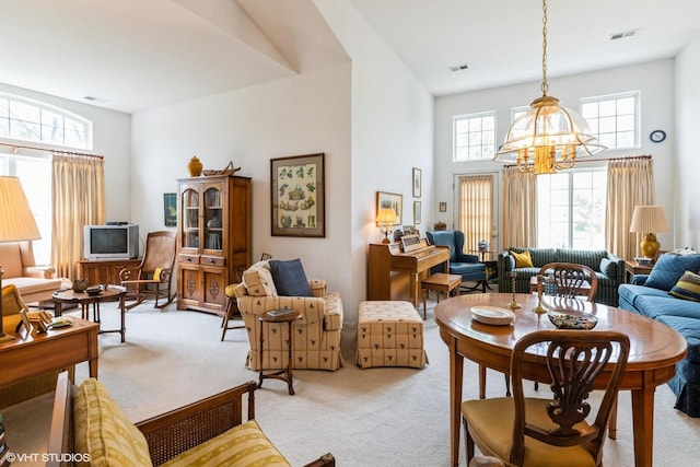 645 Concord Way Unit 645, Prospect Heights, IL 60070 - living area with light colored carpet, a chandelier, and a high ceiling