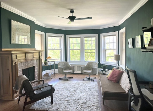 208 N Oak Park Ave Unit 3Jj, Oak Park, IL 60302 - living room featuring wood finished floors, a brick fireplace, ceiling fan, and crown molding