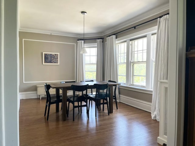 208 N Oak Park Ave Unit 3Jj, Oak Park, IL 60302 - dining room featuring dark wood-style floors, baseboards, and crown molding
