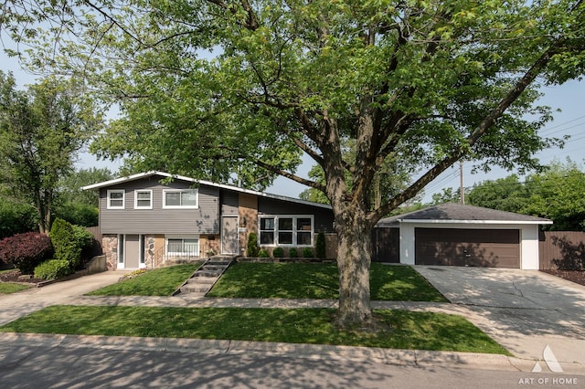 5700 Grange Ave, Oak Forest, IL 60452 - tri-level home with stone siding, a garage, concrete driveway, and a front lawn