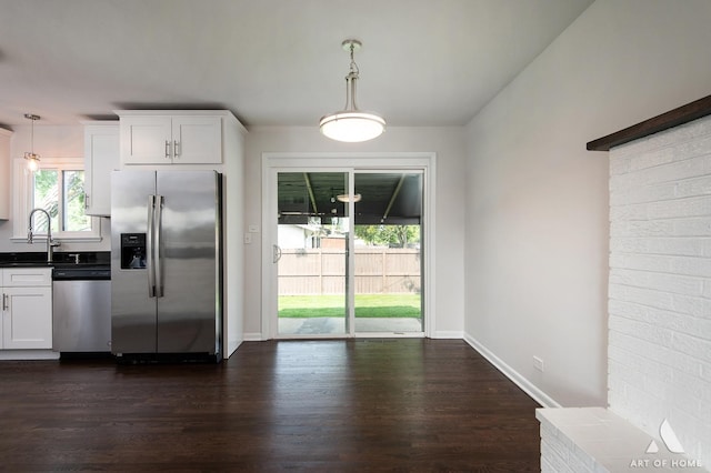5700 Grange Ave, Oak Forest, IL 60452 - kitchen with appliances with stainless steel finishes, a sink, dark wood-style flooring, white cabinetry, and decorative light fixtures