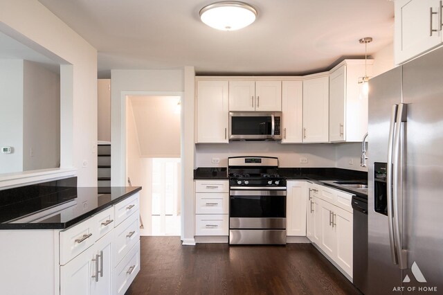 5700 Grange Ave, Oak Forest, IL 60452 - kitchen with stainless steel appliances, dark countertops, dark wood-style flooring, and white cabinetry