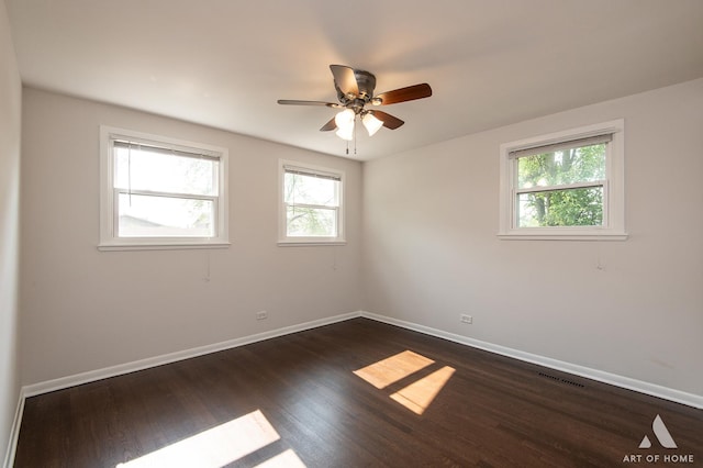 5700 Grange Ave, Oak Forest, IL 60452 - spare room featuring baseboards, dark wood finished floors, and a ceiling fan