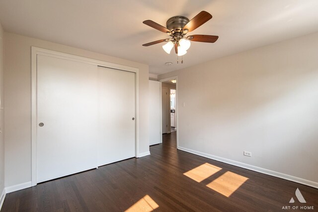 5700 Grange Ave, Oak Forest, IL 60452 - unfurnished bedroom featuring dark wood finished floors, baseboards, and a closet