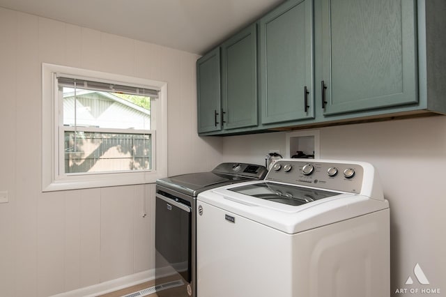 5700 Grange Ave, Oak Forest, IL 60452 - washroom featuring cabinet space, separate washer and dryer, and baseboards