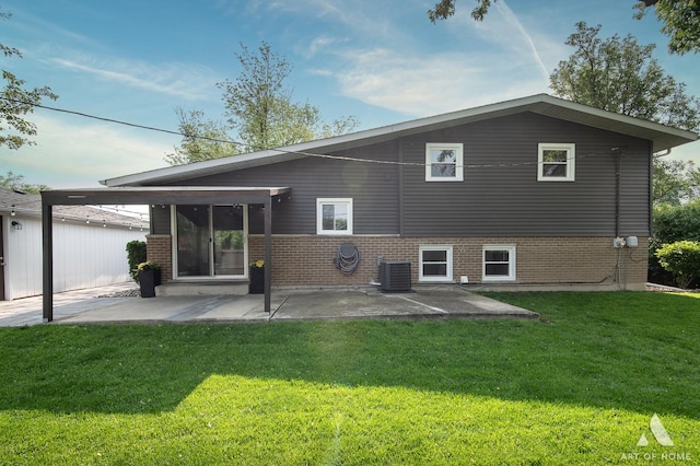 5700 Grange Ave, Oak Forest, IL 60452 - back of property with brick siding, central AC, a patio, and a yard
