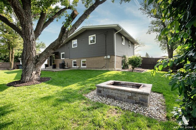 5700 Grange Ave, Oak Forest, IL 60452 - back of house featuring a fire pit, a patio area, and brick siding