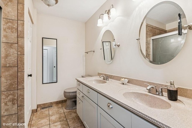 1063 Ridgefield Cir, Carol Stream, IL 60188 - full bathroom with toilet, double vanity, a tile shower, tile patterned flooring, and baseboards