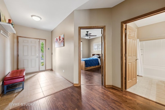825 Colchester Dr, Oswego, IL 60543 - foyer with hardwood / wood-style floors, baseboards, and ceiling fan