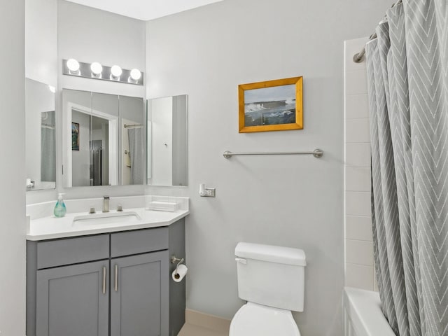 222 N Columbus Dr Unit 2408, Chicago, IL 60601 - bathroom with vanity, toilet, shower / bath combo with shower curtain, and baseboards