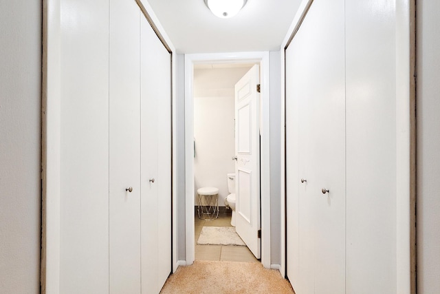 5235 James Ln Unit 1202, Crestwood, IL 60418 - hallway with light tile patterned flooring and light colored carpet