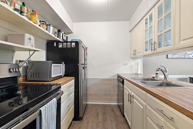 5235 James Ln Unit 1202, Crestwood, IL 60418 - kitchen featuring stainless steel appliances, a sink, butcher block counters, open shelves, and dark wood-style floors
