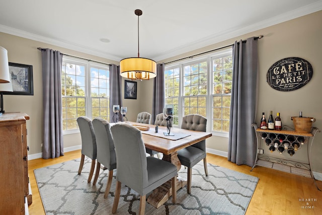 605 Birch Ln, Fox River Grove, IL 60021 - dining area featuring crown molding, light wood-style flooring, healthy amount of natural light, and baseboards