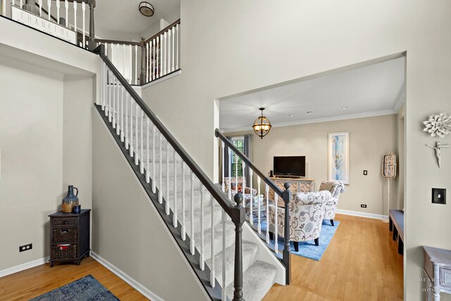 605 Birch Ln, Fox River Grove, IL 60021 - staircase featuring wood finished floors, baseboards, and ornamental molding