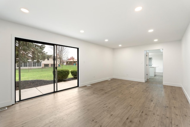 7723 W 157th St, Orland Park, IL 60462 - empty room featuring recessed lighting, light wood finished floors, and baseboards