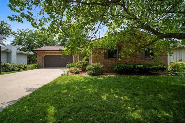 315 S Bone Dr, Normal, IL 61761 - ranch-style house featuring brick siding, a garage, a front yard, and driveway
