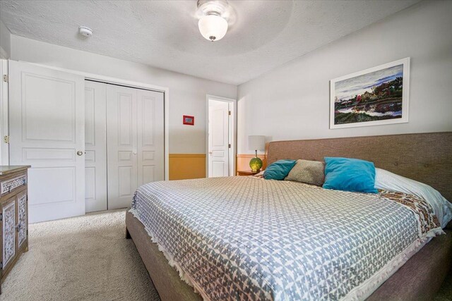 315 S Bone Dr, Normal, IL 61761 - bedroom with carpet floors, a closet, and a textured ceiling