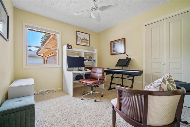 315 S Bone Dr, Normal, IL 61761 - carpeted home office with a textured ceiling and ceiling fan