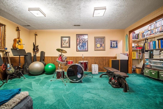 315 S Bone Dr, Normal, IL 61761 - exercise area featuring carpet flooring, a textured ceiling, and a wainscoted wall