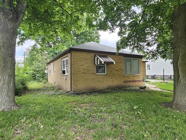 1212 N Mill St, Pontiac, IL 61764 - view of property exterior with brick siding and a lawn