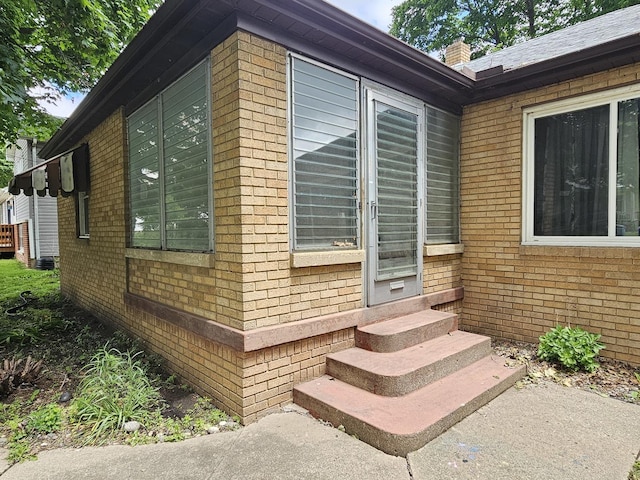 1212 N Mill St, Pontiac, IL 61764 - view of side of home with brick siding and entry steps