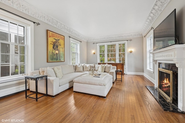 1025 Sheridan Rd, Wilmette, IL 60091 - living room featuring a high end fireplace, hardwood / wood-style floors, and baseboards