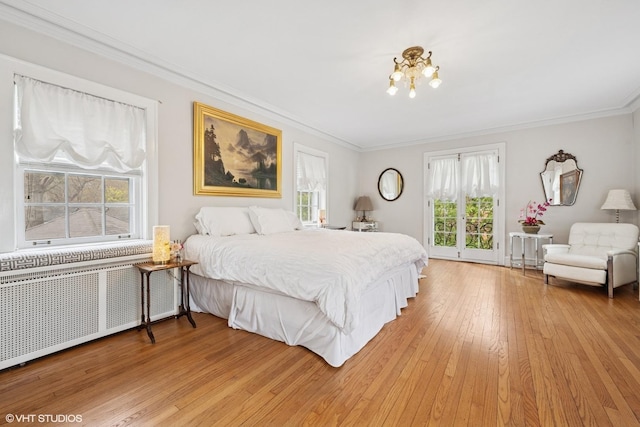 1025 Sheridan Rd, Wilmette, IL 60091 - bedroom with radiator heating unit, access to exterior, ornamental molding, and light wood-type flooring
