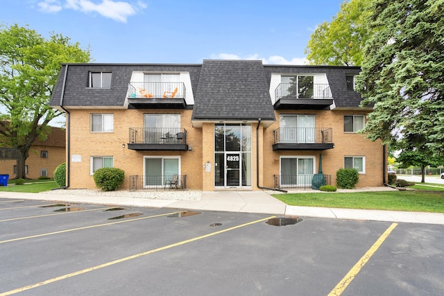 4825 W 109th St Unit 303, Oak Lawn, IL 60453 - view of building exterior featuring uncovered parking