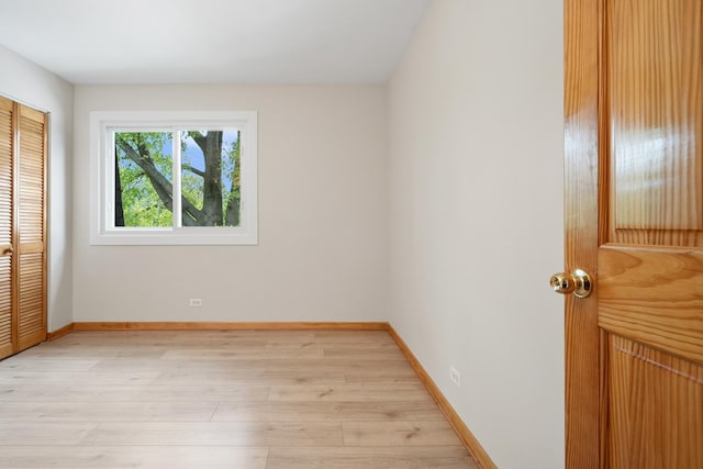 4825 W 109th St Unit 303, Oak Lawn, IL 60453 - unfurnished bedroom featuring light wood-style floors, a closet, and baseboards
