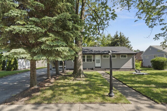 15603 Park Ln, South Holland, IL 60473 - view of front of property with entry steps, a front yard, and asphalt driveway