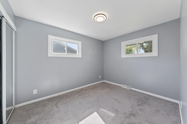 15603 Park Ln, South Holland, IL 60473 - unfurnished bedroom with carpet floors, a closet, and baseboards