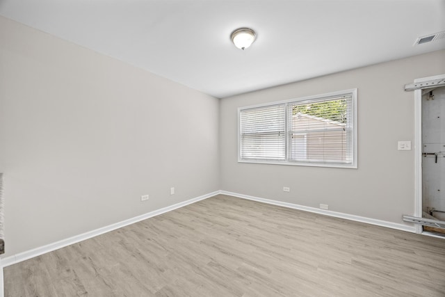 4117 W 99th St, Oak Lawn, IL 60453 - spare room featuring wood finished floors and baseboards