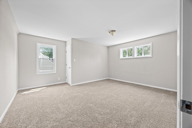 4117 W 99th St, Oak Lawn, IL 60453 - spare room featuring healthy amount of natural light, carpet flooring, and baseboards
