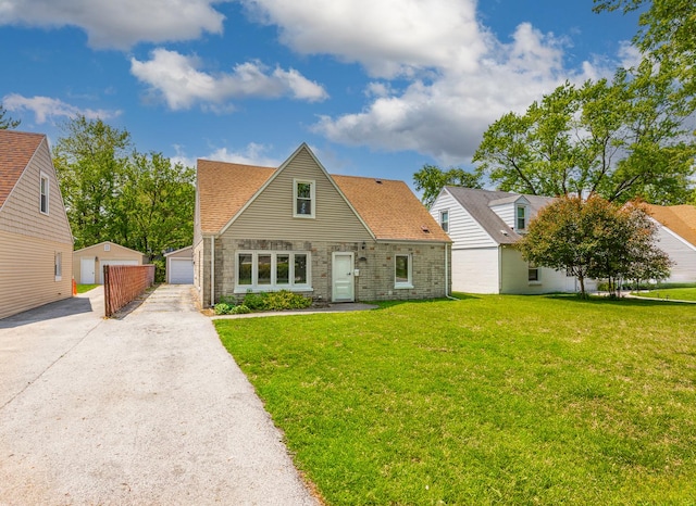4117 W 99th St, Oak Lawn, IL 60453 - view of front of home with a front yard, stone siding, an outdoor structure, a detached garage, and a shingled roof
