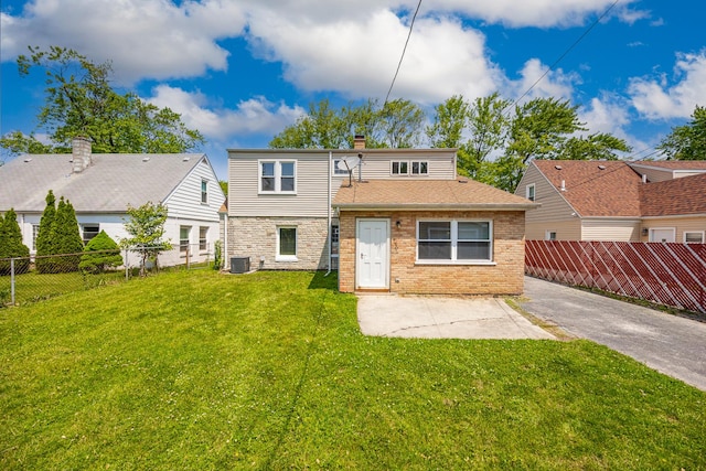 4117 W 99th St, Oak Lawn, IL 60453 - rear view of house featuring a chimney, a patio, brick siding, and cooling unit