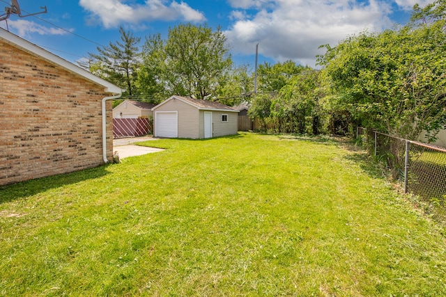 4117 W 99th St, Oak Lawn, IL 60453 - view of yard featuring a detached garage, an outdoor structure, and driveway