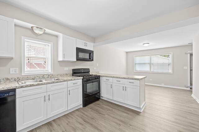 4117 W 99th St, Oak Lawn, IL 60453 - kitchen with black appliances, a sink, a peninsula, and light wood finished floors