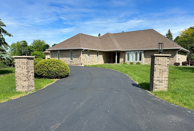 9317 Firth Ct, Lakewood, IL 60014 - view of front of property featuring a front lawn, driveway, and brick siding