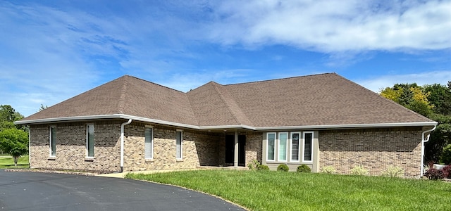 9317 Firth Ct, Lakewood, IL 60014 - view of front facade featuring brick siding, a front lawn, and a shingled roof