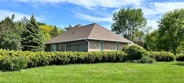9317 Firth Ct, Lakewood, IL 60014 - view of property exterior featuring brick siding, roof with shingles, a yard, and an attached garage