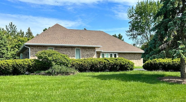 9317 Firth Ct, Lakewood, IL 60014 - view of property exterior with brick siding, a yard, and roof with shingles