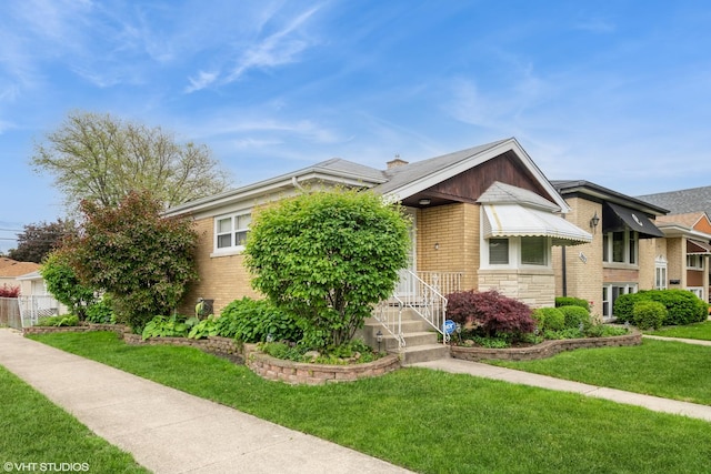 3801 S Lombard Ave, Cicero, IL 60804 - view of front of house with a front lawn and brick siding